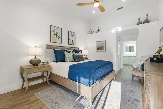 a bedroom with a bed and a couch