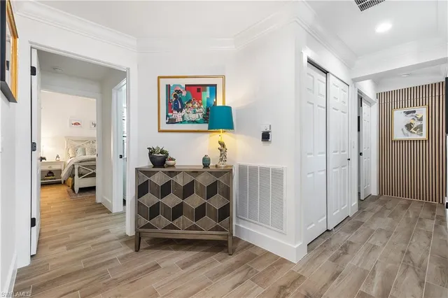 a view of a livingroom with furniture and hardwood floor