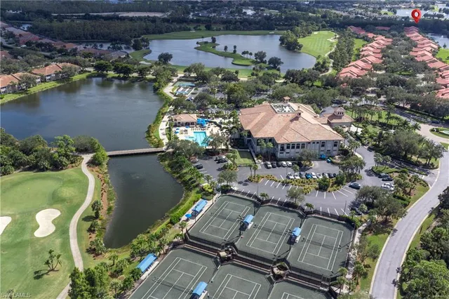 an aerial view of a house with a lake view