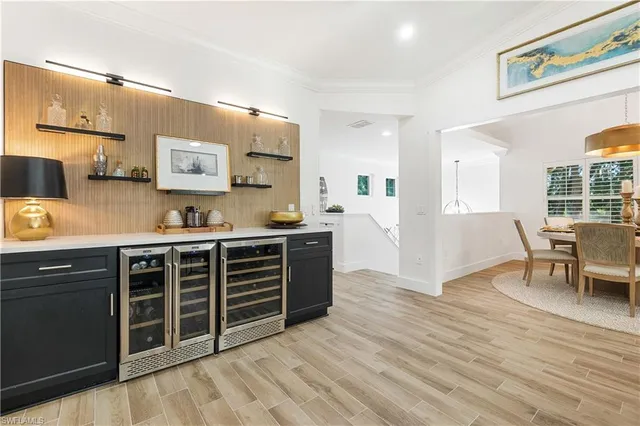 a kitchen with stainless steel appliances a stove and cabinets