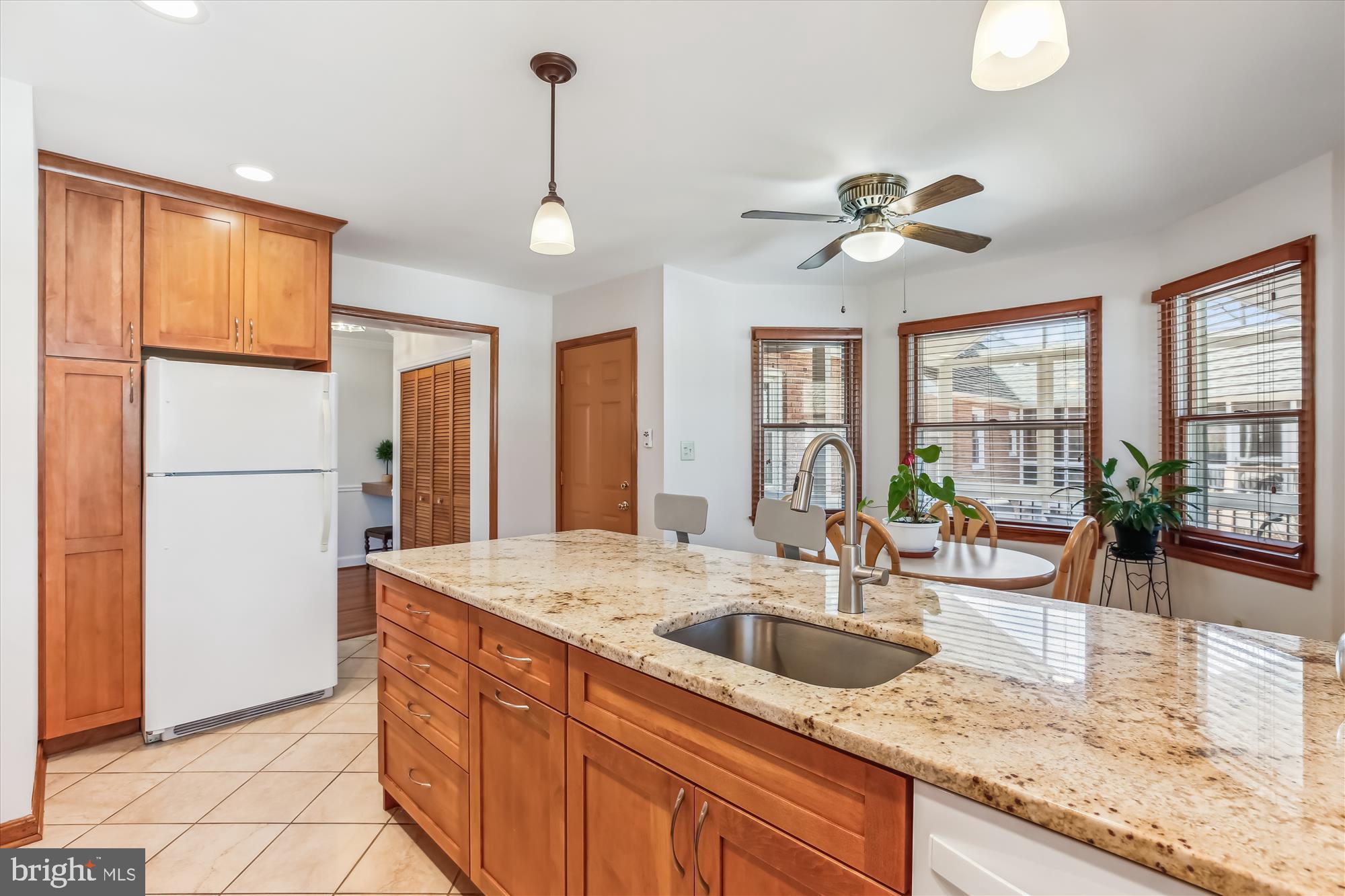 1711 Cody Drive Silver Spring, MD 20902 - Photo 16 of 50 a kitchen with sink refrigerator and window