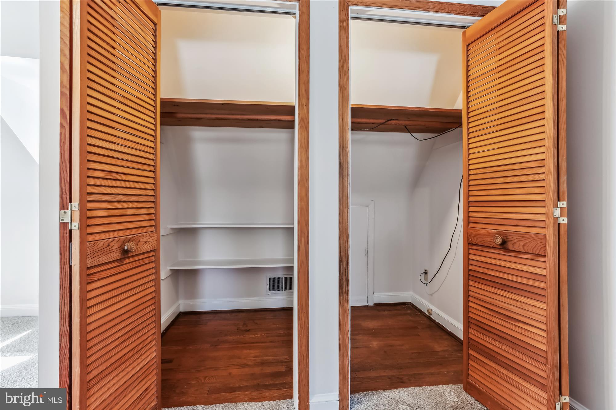 1711 Cody Drive Silver Spring, MD 20902 - Photo 36 of 50 a view of closet area with empty racks
