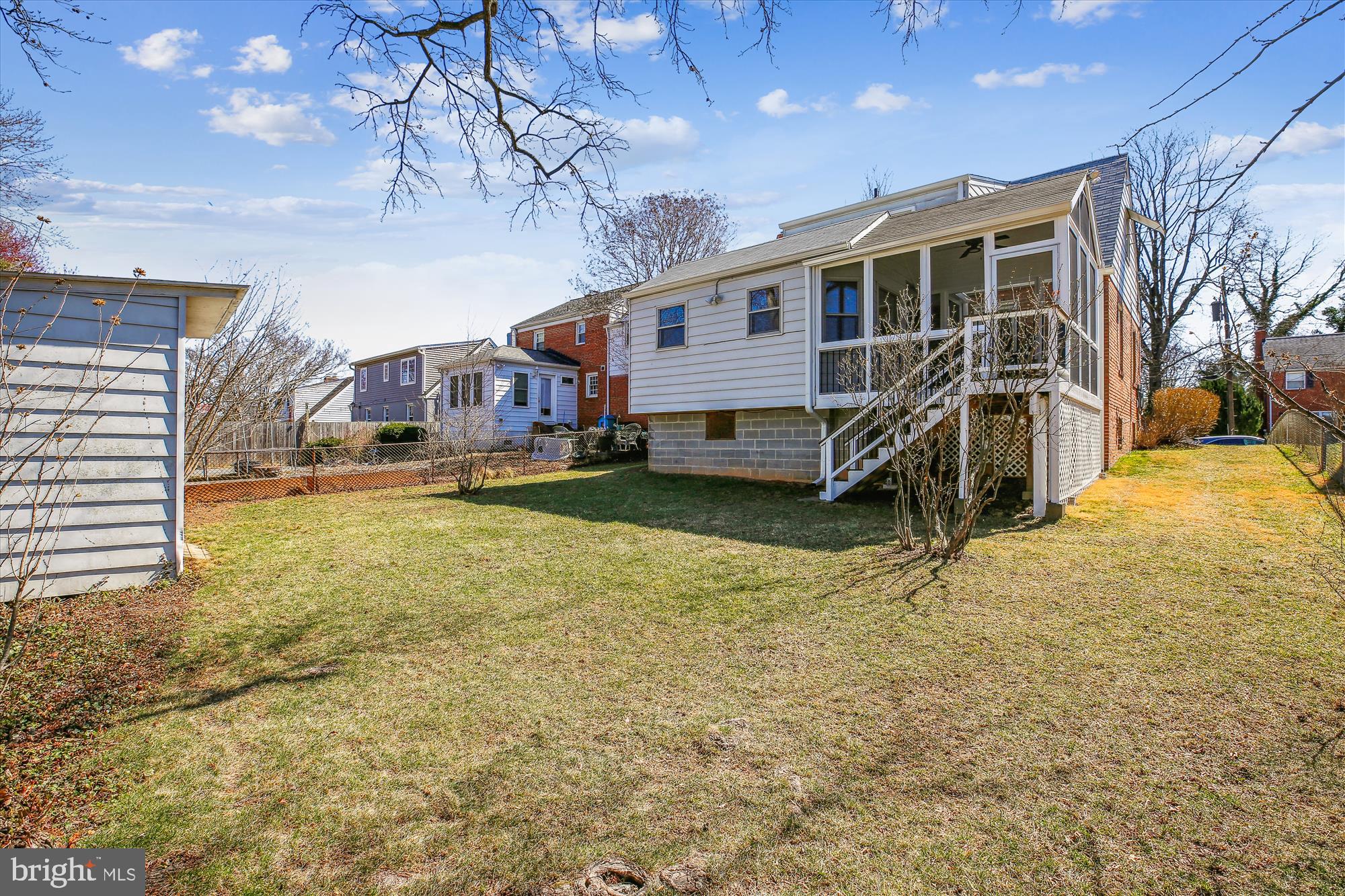 1711 Cody Drive Silver Spring, MD 20902 - Photo 46 of 50 a view of a house with a yard covered with snow in center