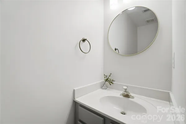 a bathroom with a sink and mirror