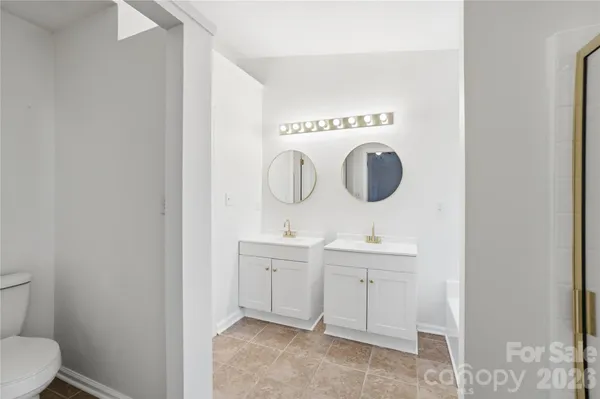 a bathroom with a toilet and a sink