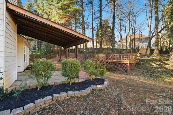 a backyard of a house with lots of green space