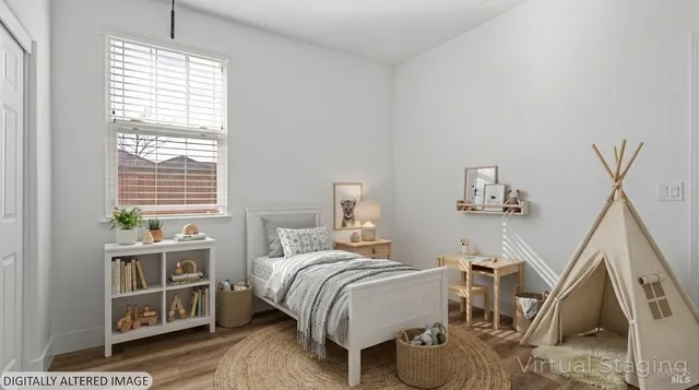 a bedroom with a bed and a window