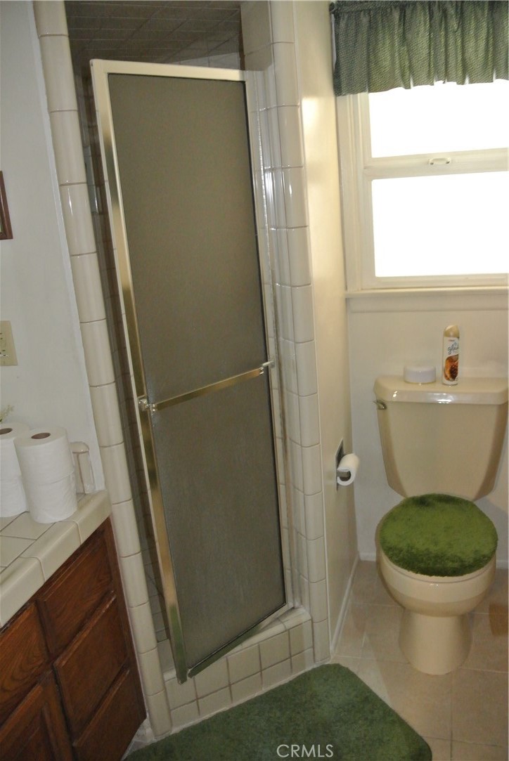 6460 Dos Rios Road Downey, CA 90240 - Photo 19 of 34 a bathroom with a sink and toilet
