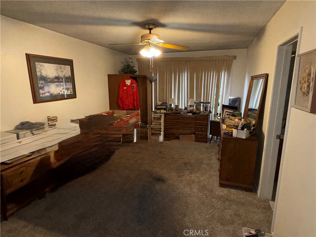 6460 Dos Rios Road Downey, CA 90240 - Photo 20 of 34 a living room with furniture and a flat screen tv