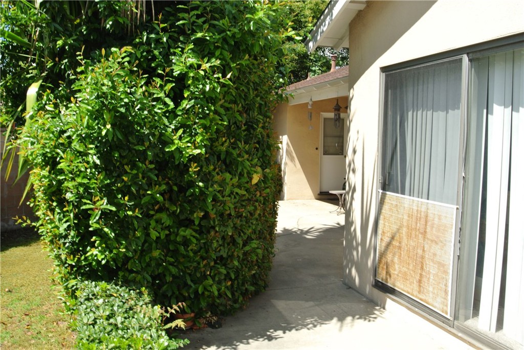 6460 Dos Rios Road Downey, CA 90240 - Photo 24 of 34 a view of a house with a backyard