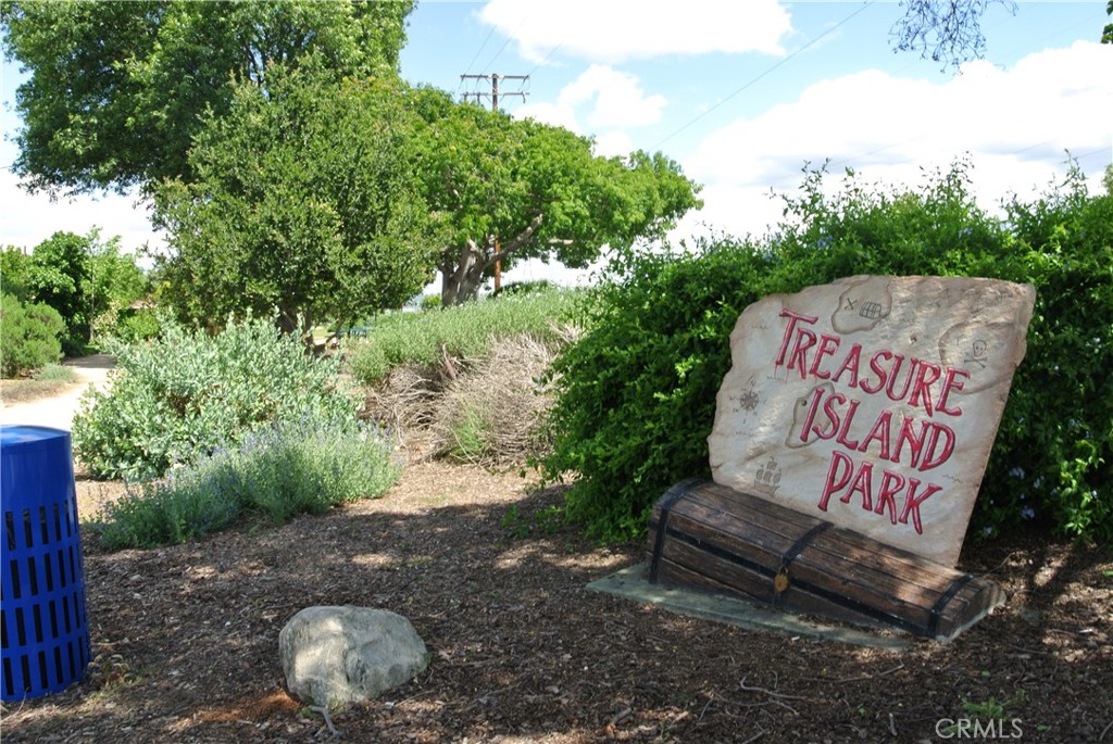 6460 Dos Rios Road Downey, CA 90240 - Photo 30 of 34 a sign that is sitting on the wooden floor