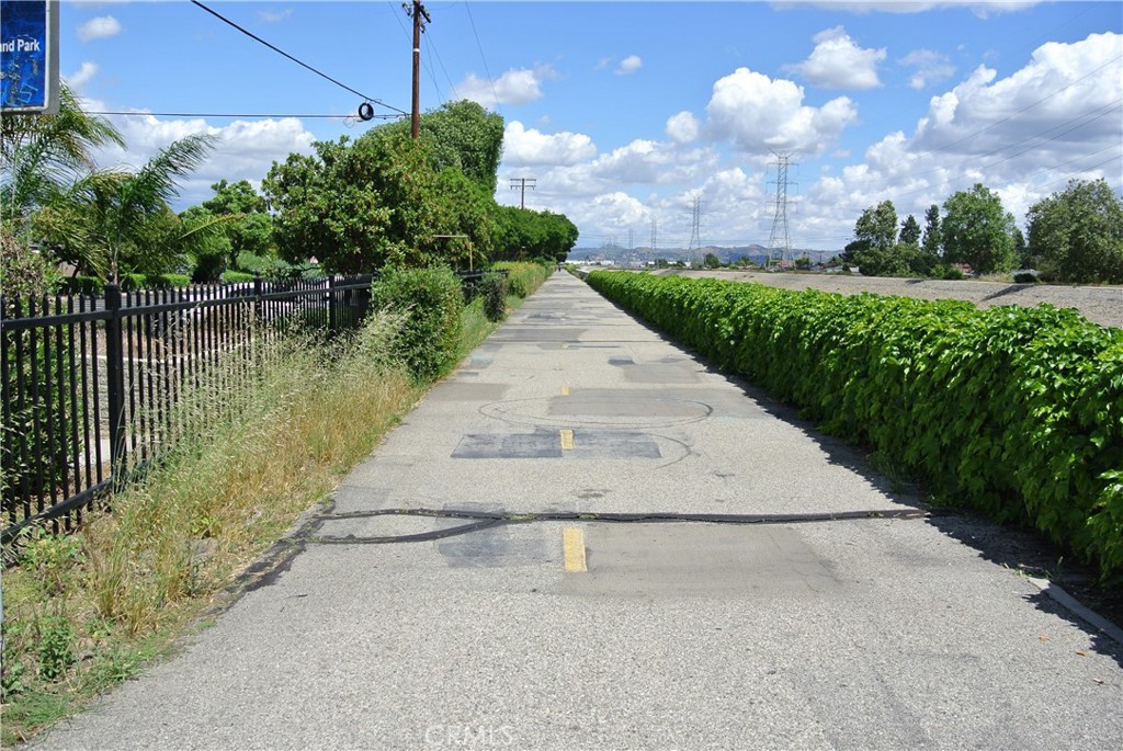 6460 Dos Rios Road Downey, CA 90240 - Photo 32 of 34 a view of a pathway both side of house and a yard