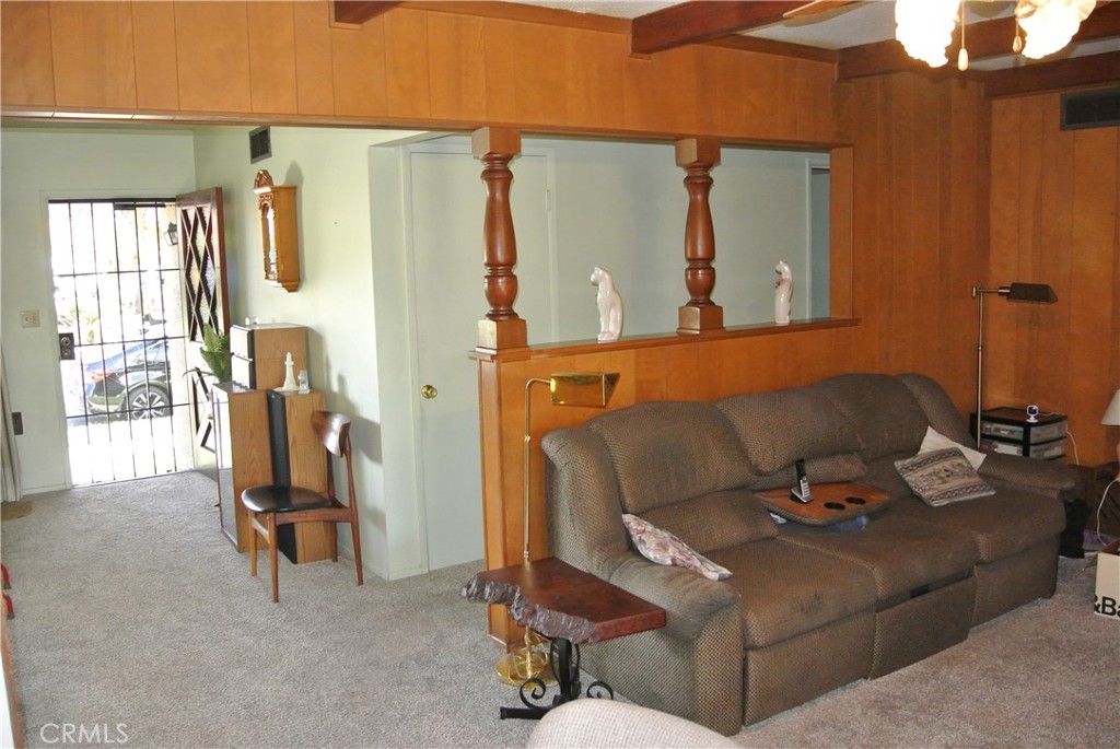 6460 Dos Rios Road Downey, CA 90240 - Photo 9 of 34 a living room with furniture and a window