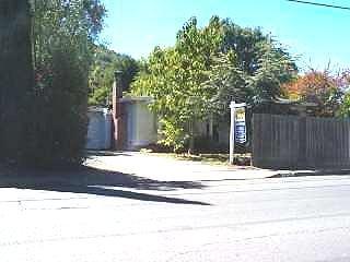 1733 Center Road Novato, CA 94947 - Photo 1 of 1 a wooden bench sitting in front of a house