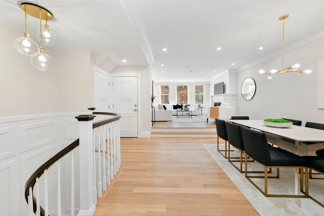 a lobby with furniture and a mirror