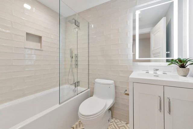 a bathroom with a toilet sink and a bathtub