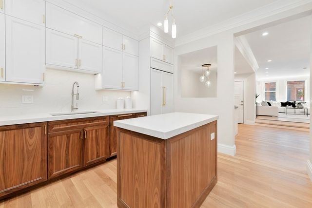 a kitchen with stainless steel appliances granite countertop a sink and cabinets