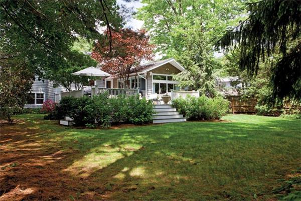 70 Clifton Road Newton, MA 02459 - Photo 11 of 13 a front view of a house with a garden