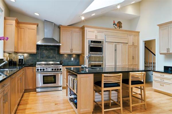 70 Clifton Road Newton, MA 02459 - Photo 7 of 13 a kitchen with stainless steel appliances granite countertop a stove and a sink