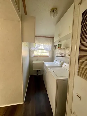 a kitchen with a sink a refrigerator and window
