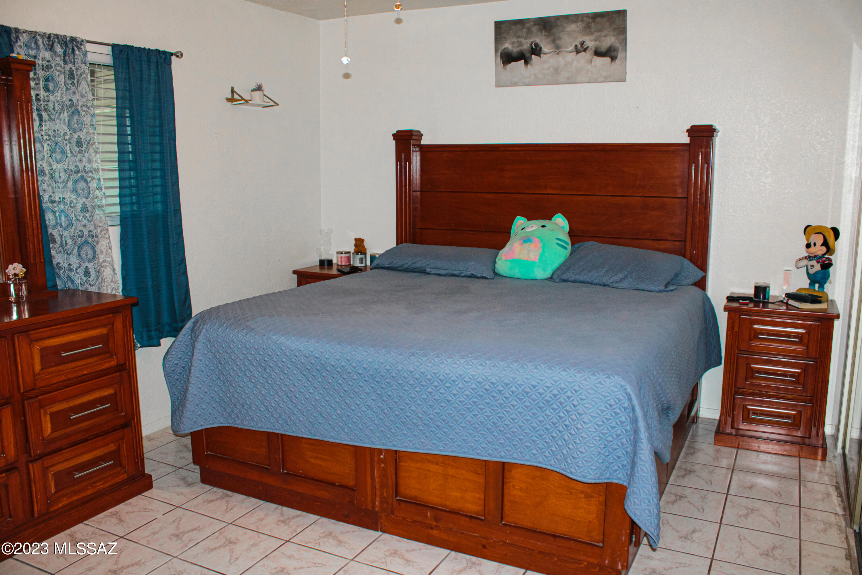 282 Paseo Mascota Rio Rico, AZ 85648 - Photo 15 of 18 a bedroom with a bed and dresser