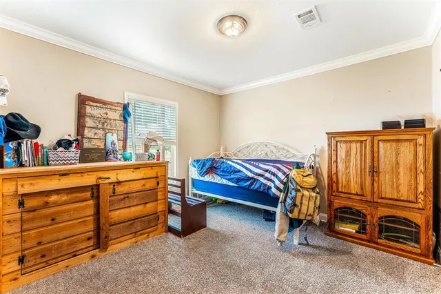 a bedroom with furniture and a closet