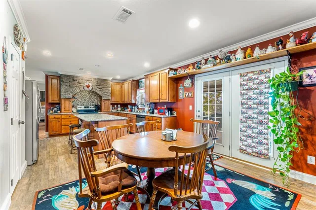 a outdoor dining space with furniture and a potted plant