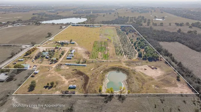 an aerial view of a residential building and ocean view