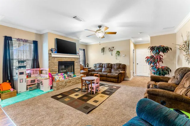a living room with furniture fireplace and a flat screen tv