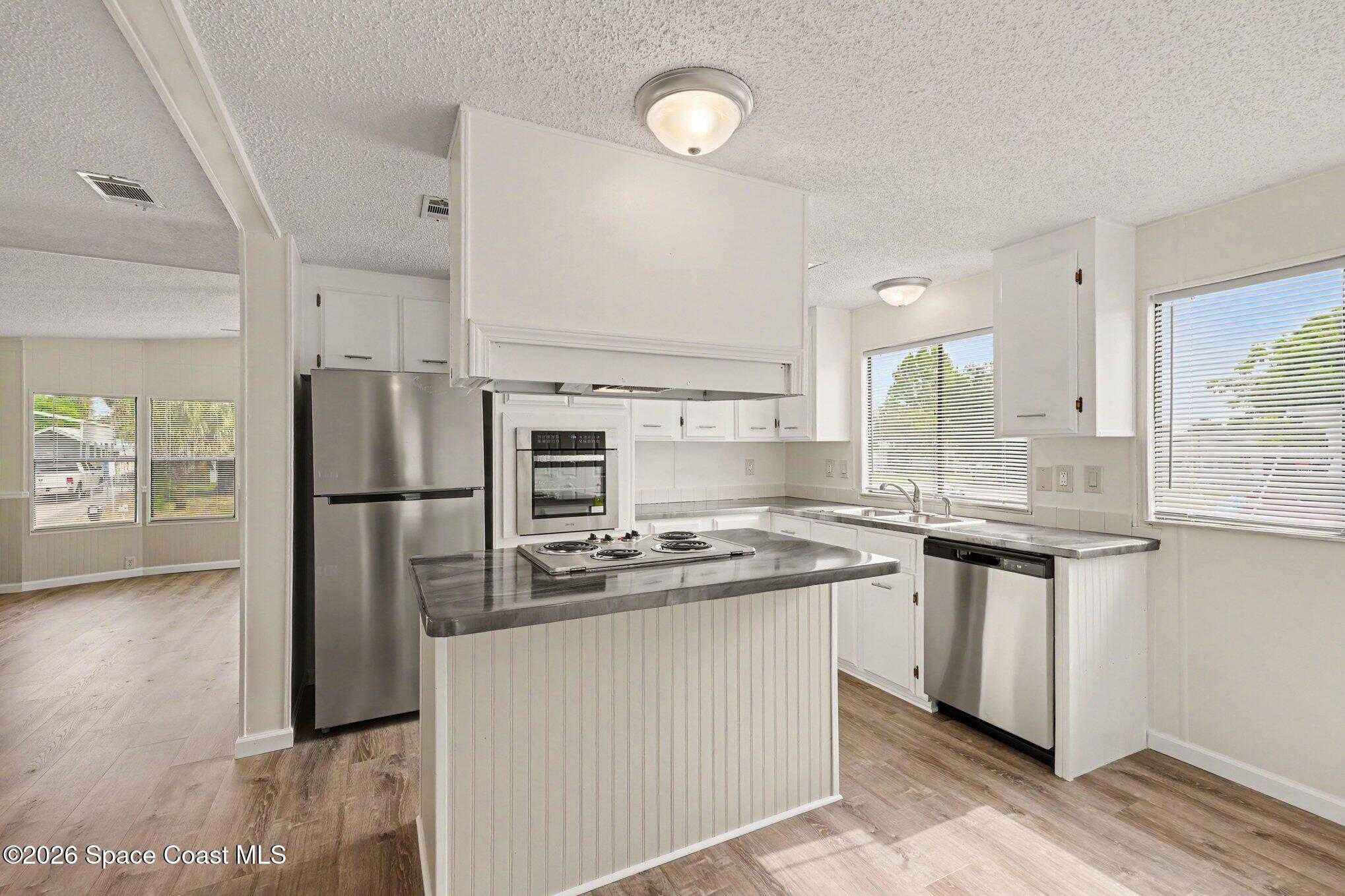 604 Breezeway Drive Cocoa, FL 32926 - Photo 8 of 26 Updated kitchen with island