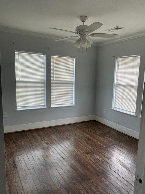 3815 Baden Street Houston, TX 77009 - Photo 2 of 7 a view of an empty room with wooden floor and a window