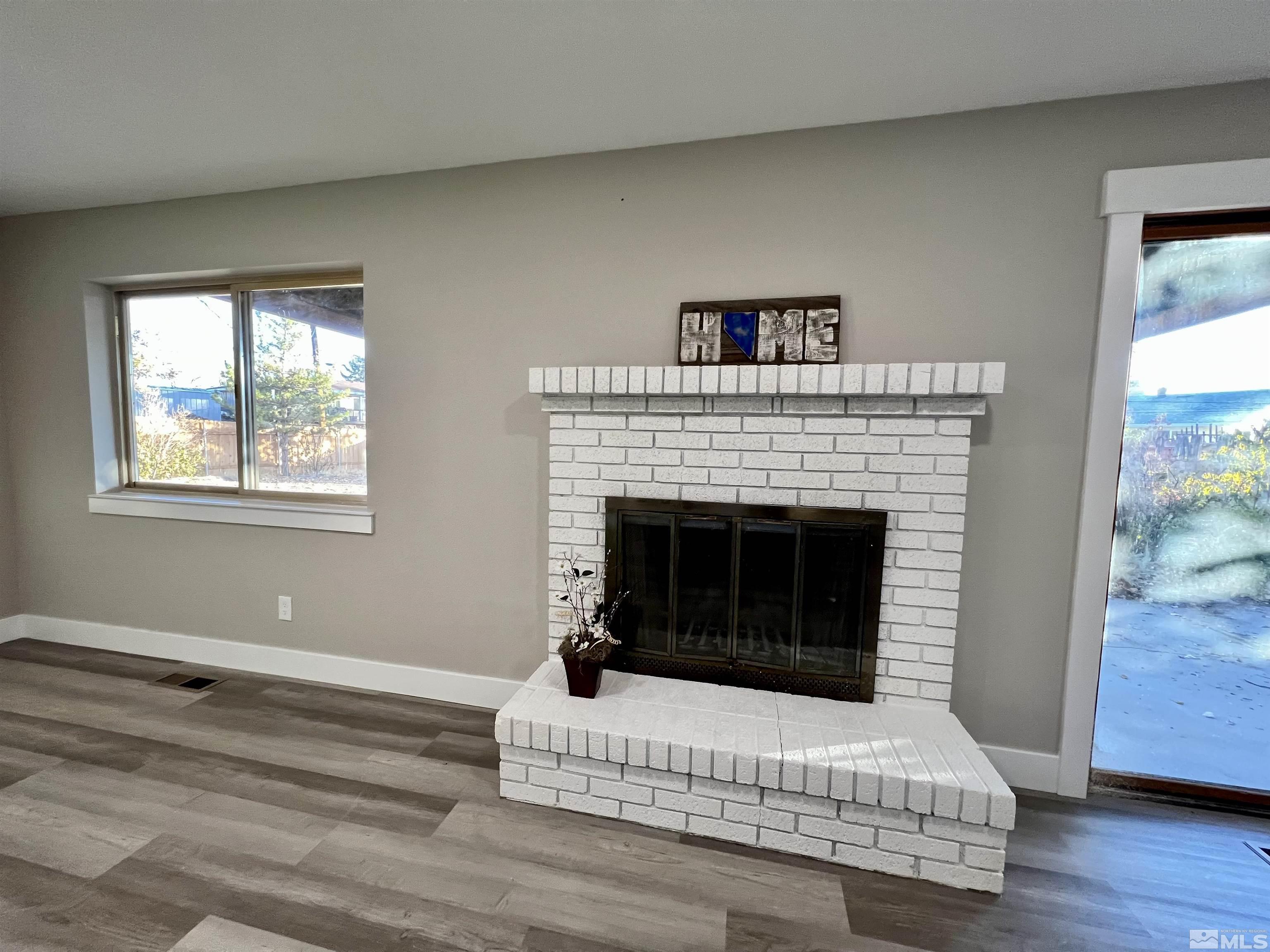 4475 Apollo Drive Carson City, NV 89706 - Photo 12 of 40 a living room with furniture and a fireplace