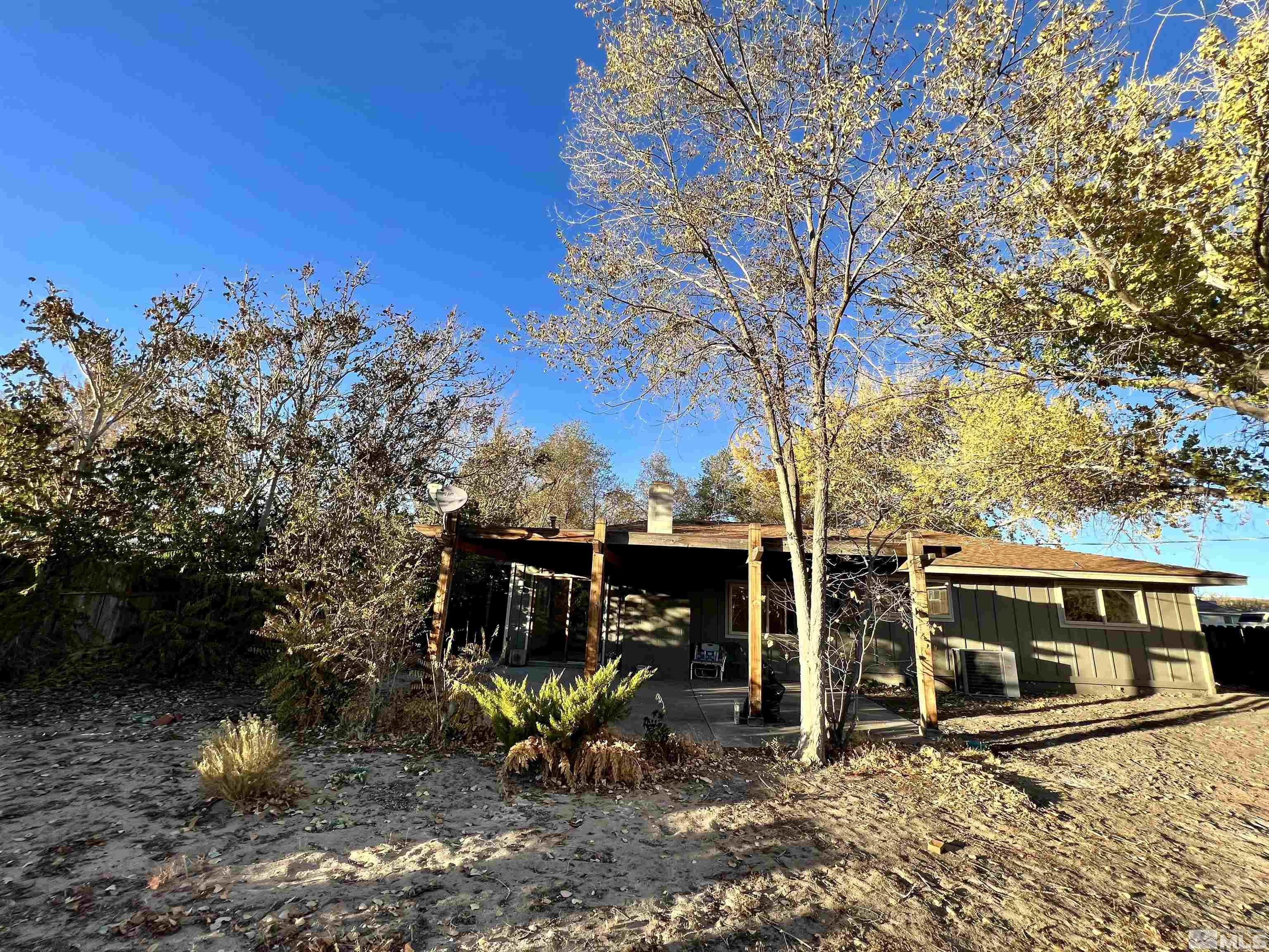 4475 Apollo Drive Carson City, NV 89706 - Photo 14 of 40 a view of a patio with table and chairs and potted plants
