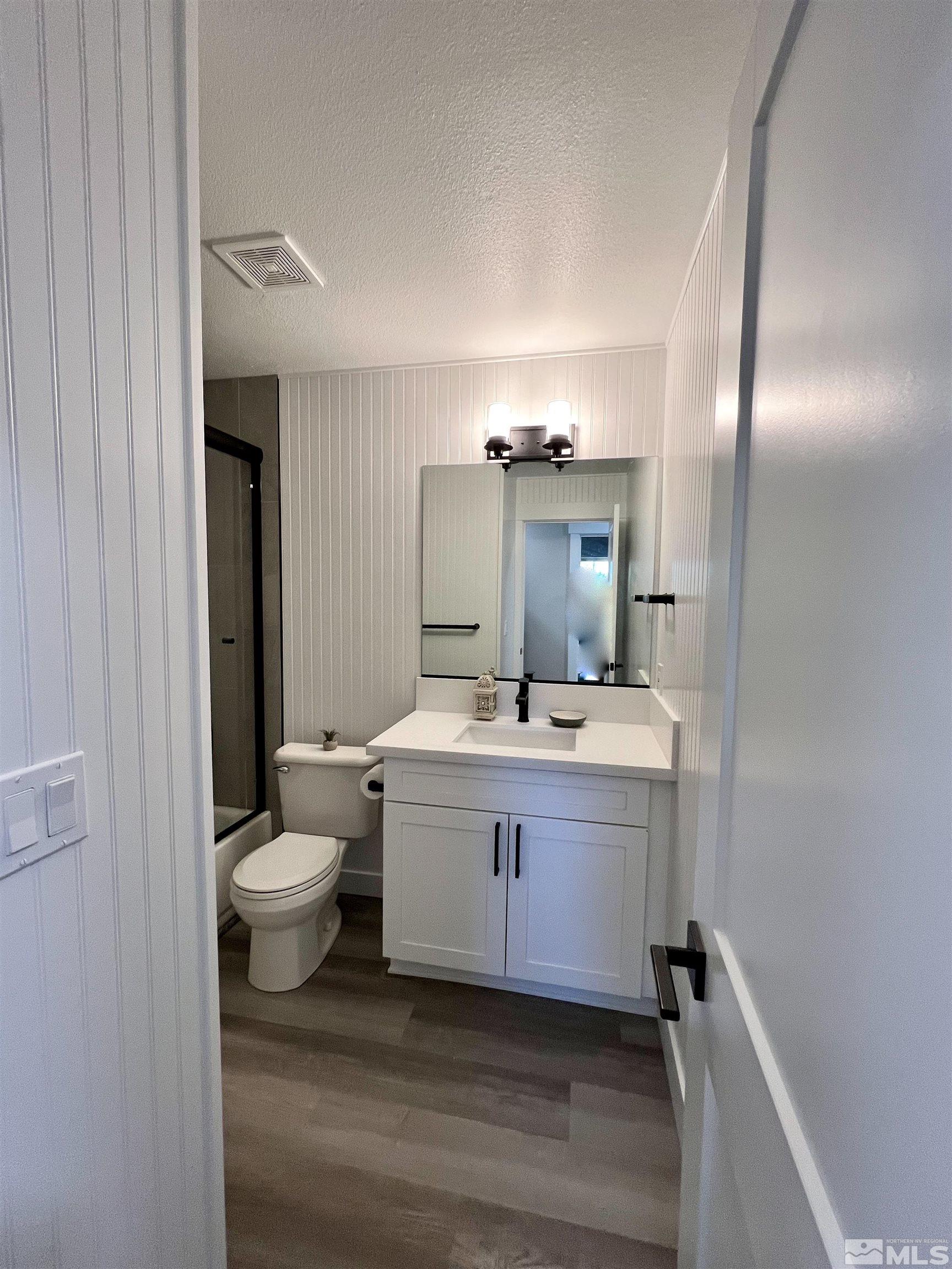 4475 Apollo Drive Carson City, NV 89706 - Photo 37 of 40 a bathroom with a sink vanity and mirror