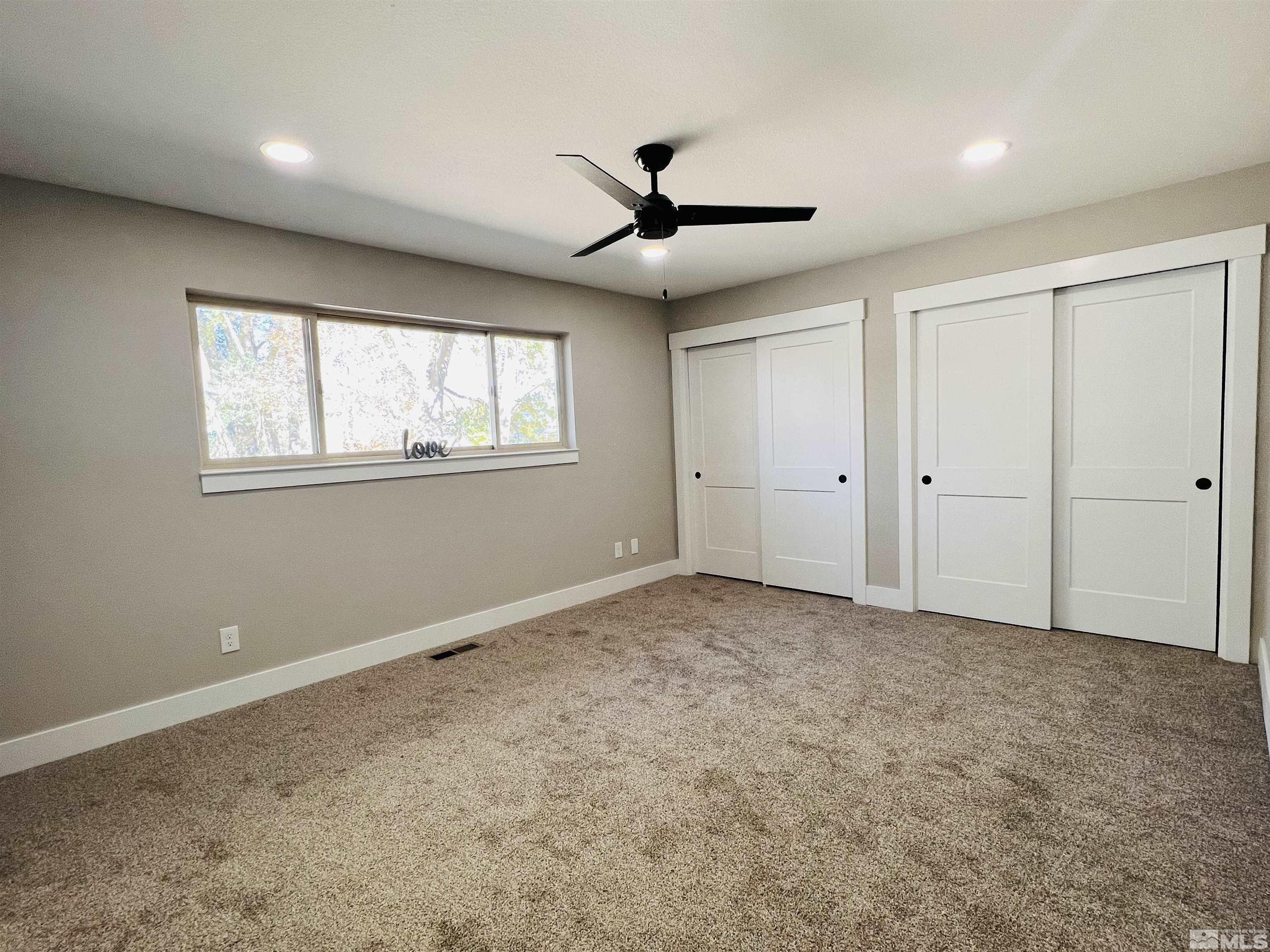4475 Apollo Drive Carson City, NV 89706 - Photo 6 of 40 a view of an empty room with a window