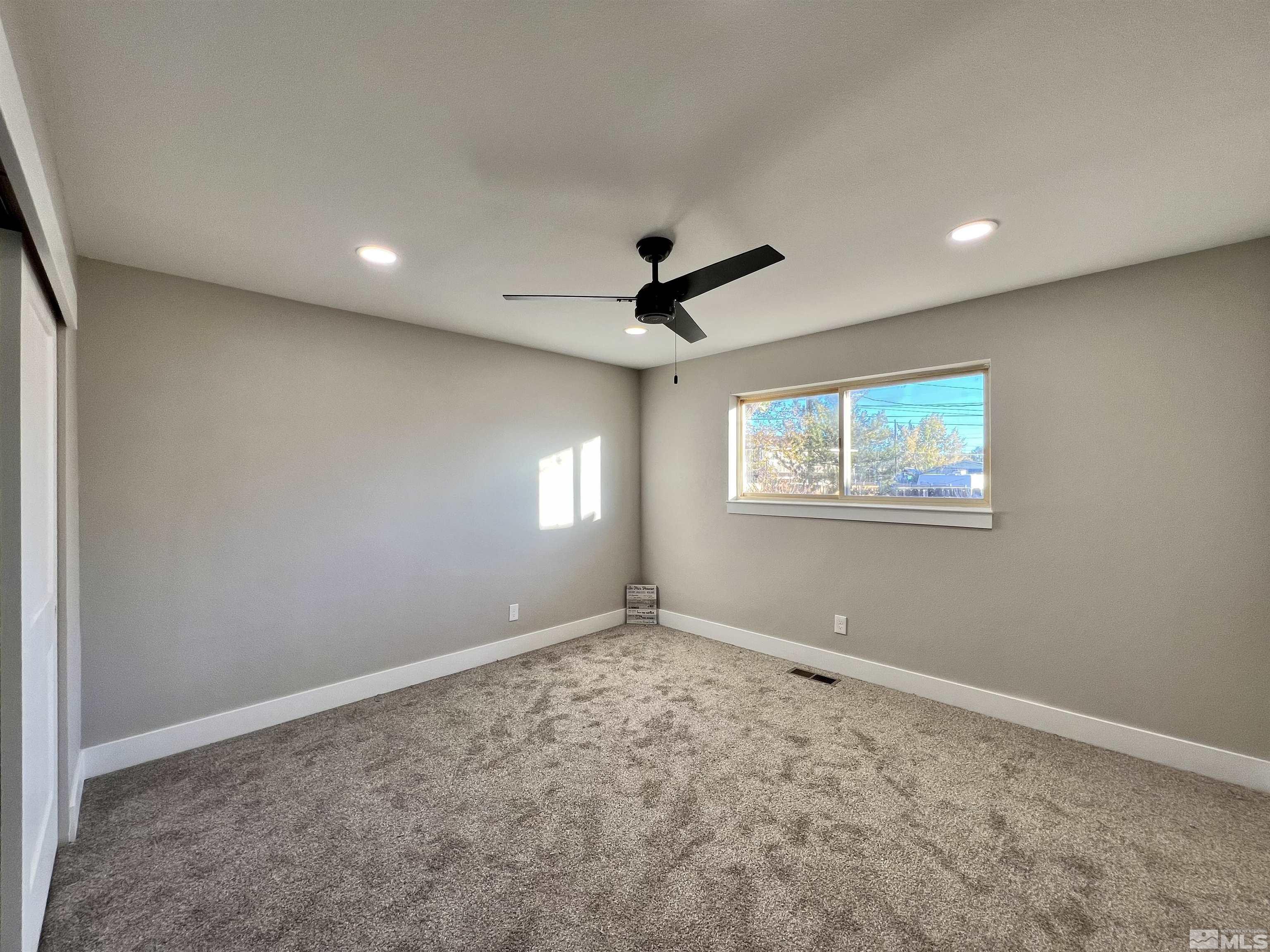 4475 Apollo Drive Carson City, NV 89706 - Photo 8 of 40 a view of an empty room with a window