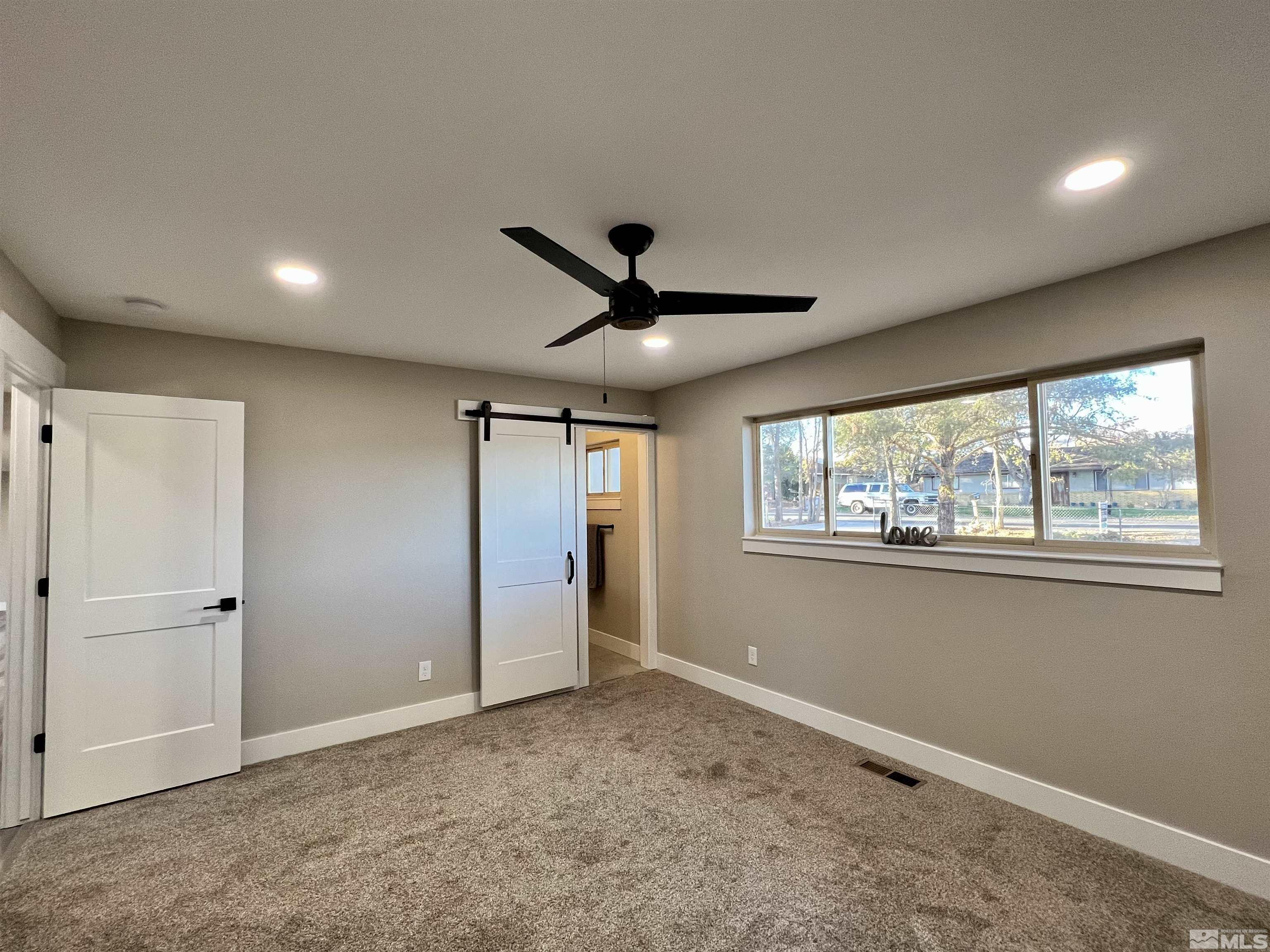 4475 Apollo Drive Carson City, NV 89706 - Photo 9 of 40 a view of an empty room with a window