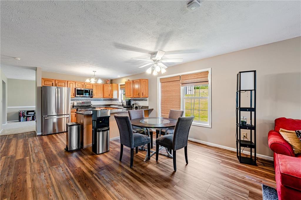 116 Mason Drive Windber, PA 15963 - Photo 12 of 35 a view of a dining room with furniture window and wooden floor