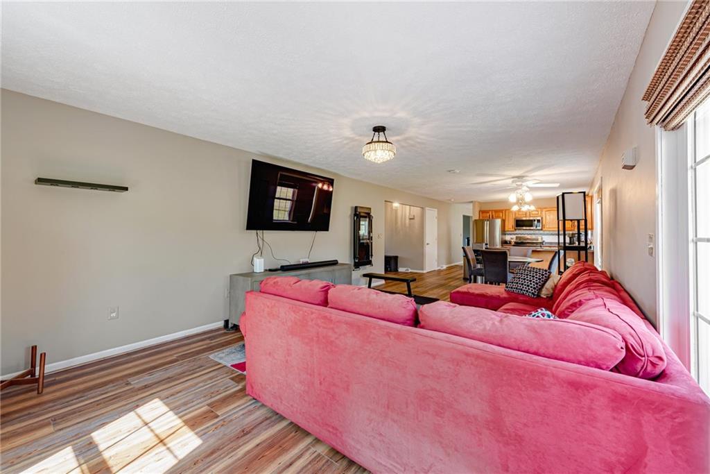 116 Mason Drive Windber, PA 15963 - Photo 15 of 35 a living room with furniture a flat screen tv and a fireplace