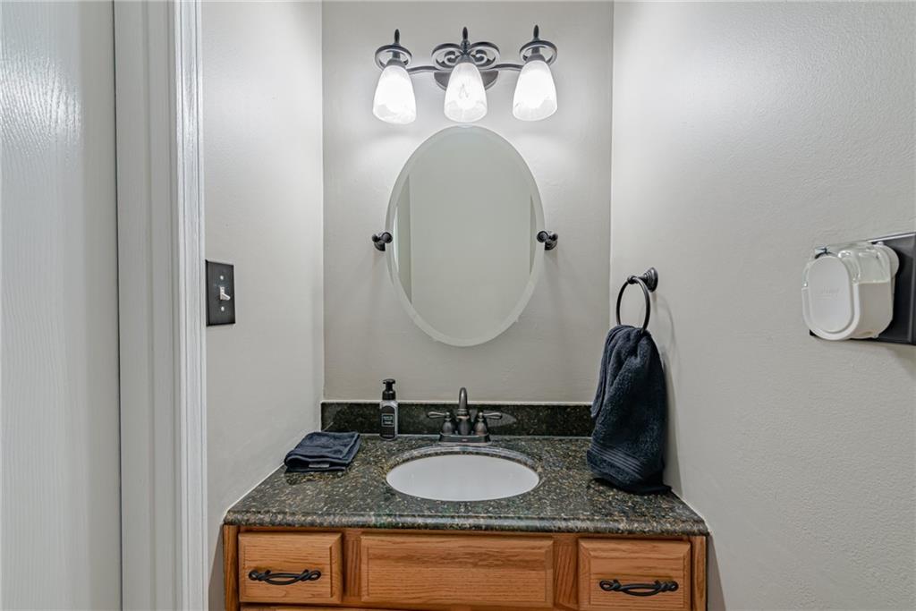 116 Mason Drive Windber, PA 15963 - Photo 16 of 35 a bathroom with a granite countertop sink and a mirror