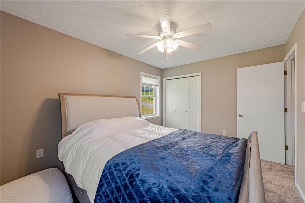 116 Mason Drive Windber, PA 15963 - Photo 23 of 35 a bedroom with a bed and a chandelier