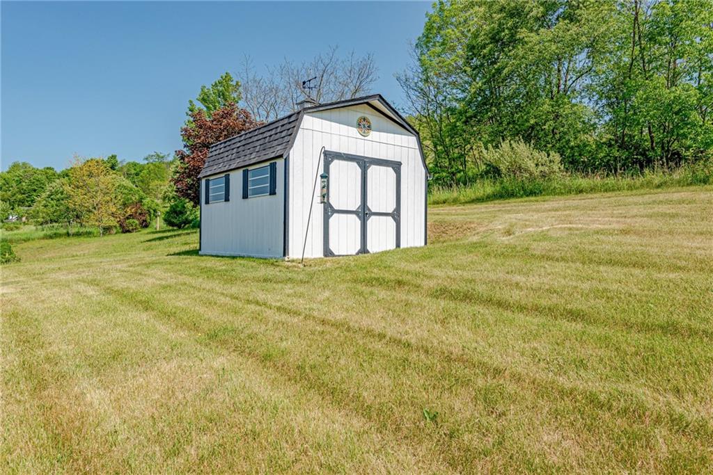 116 Mason Drive Windber, PA 15963 - Photo 34 of 35 a large yellow house with a big yard and large trees