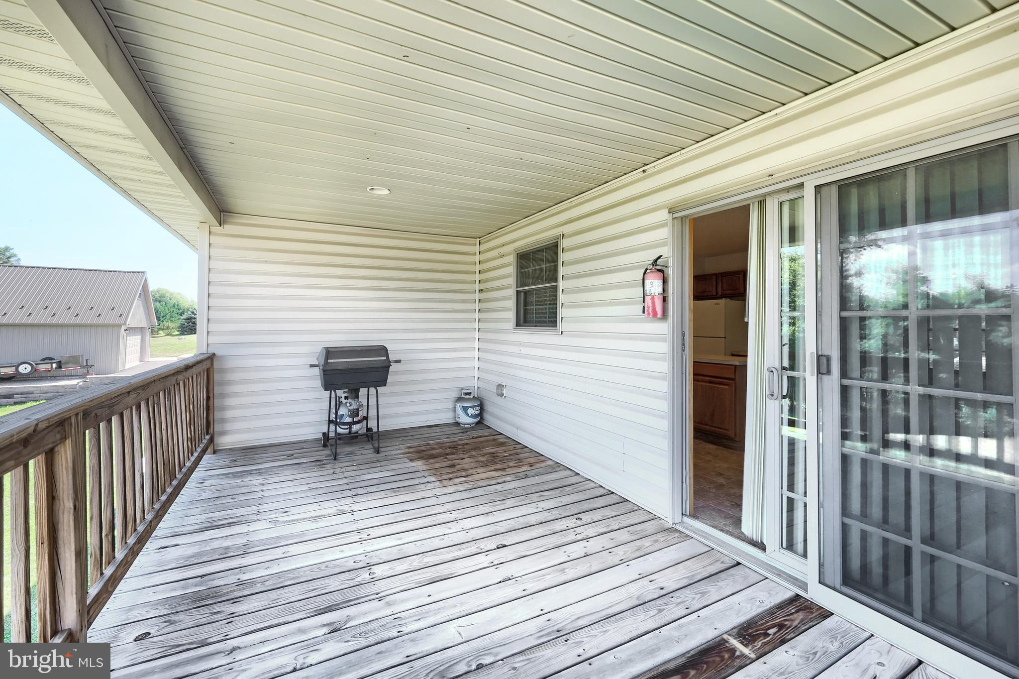 965 East Butter Road York, PA 17406 - Photo 12 of 54 a view of a patio with wooden floor