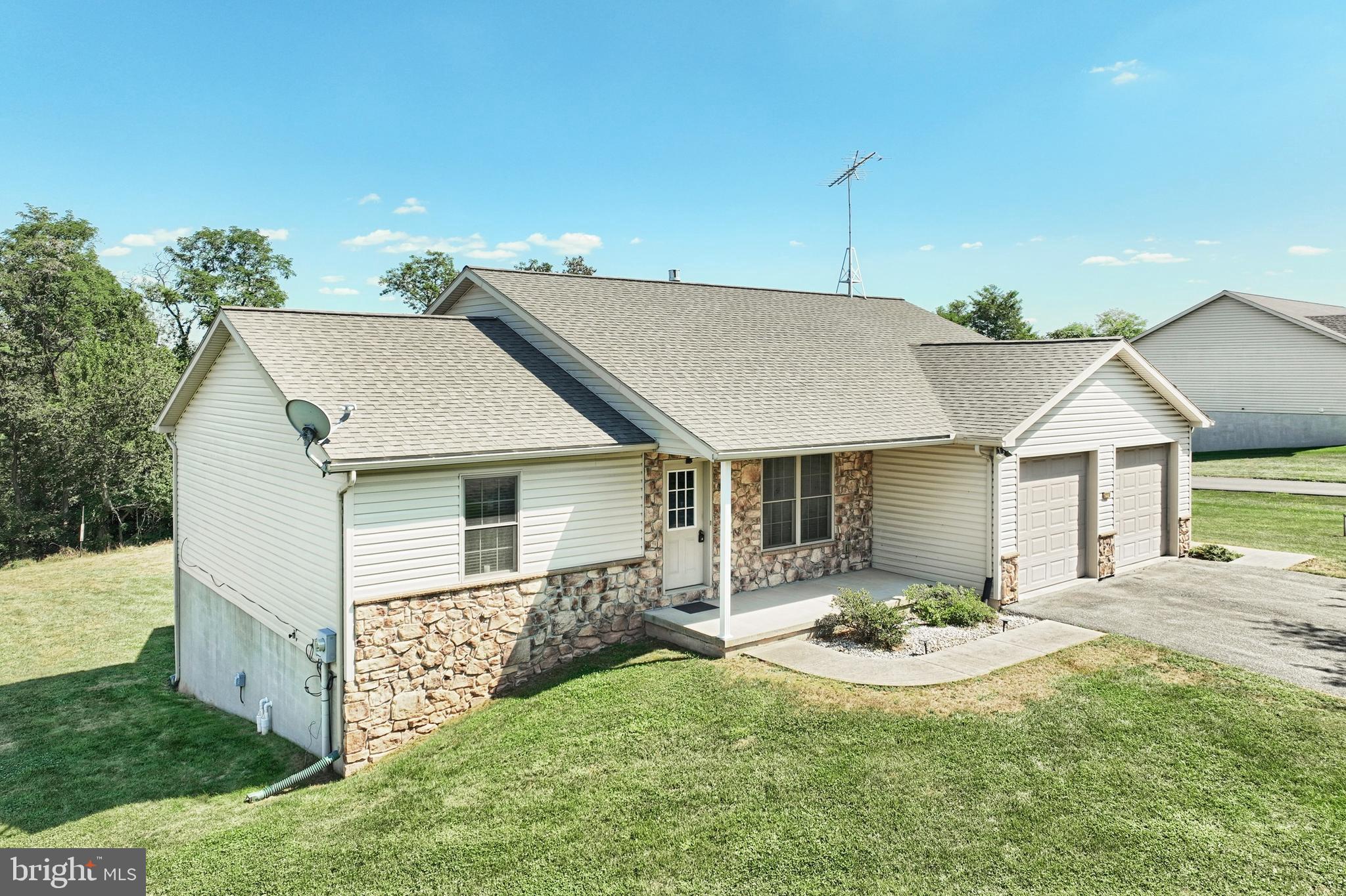 965 East Butter Road York, PA 17406 - Photo 2 of 54 a view of a house with table and chairs under an umbrella