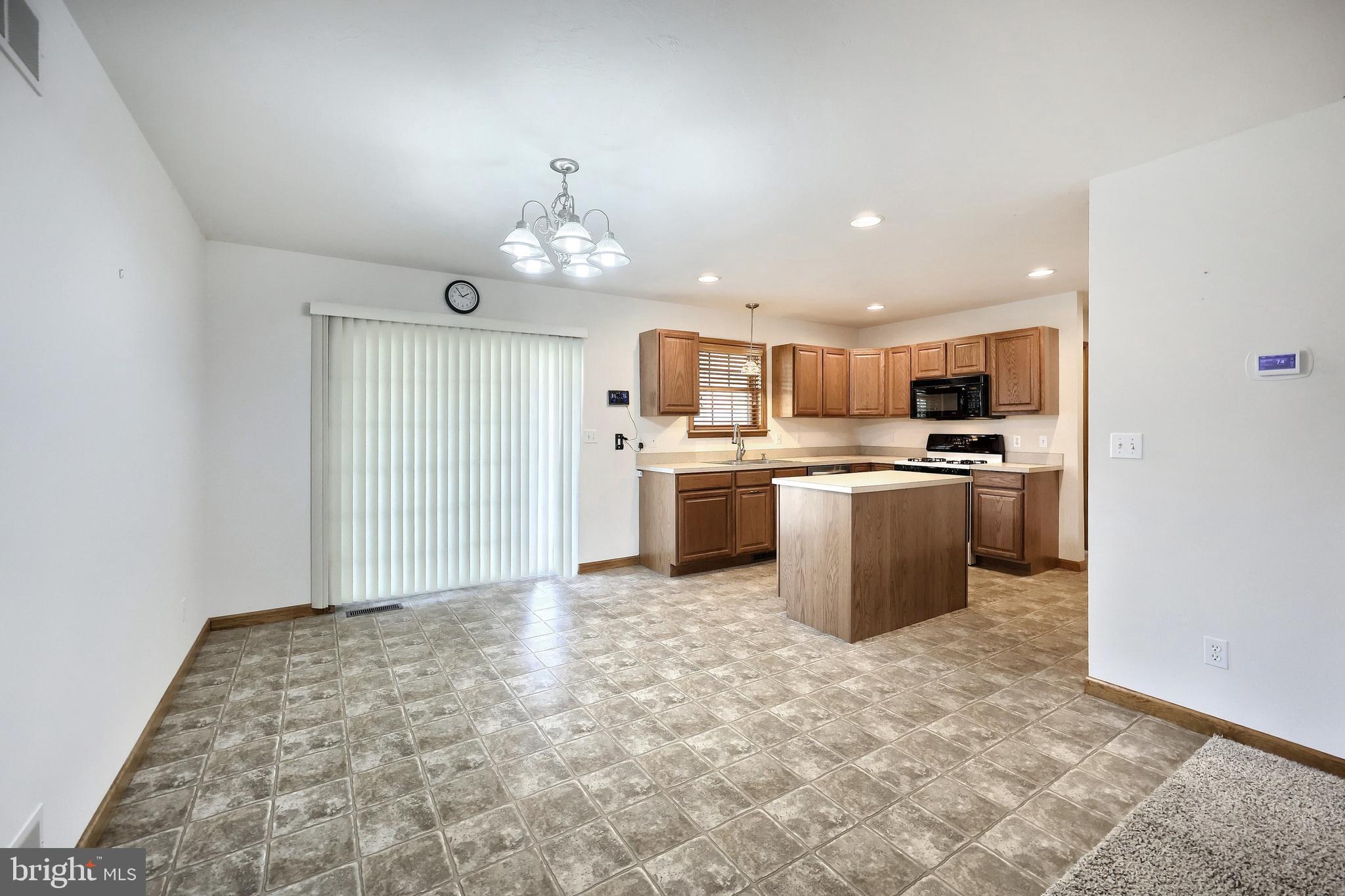 965 East Butter Road York, PA 17406 - Photo 23 of 54 a kitchen with stainless steel appliances granite countertop a stove top oven a sink dishwasher and a refrigerator