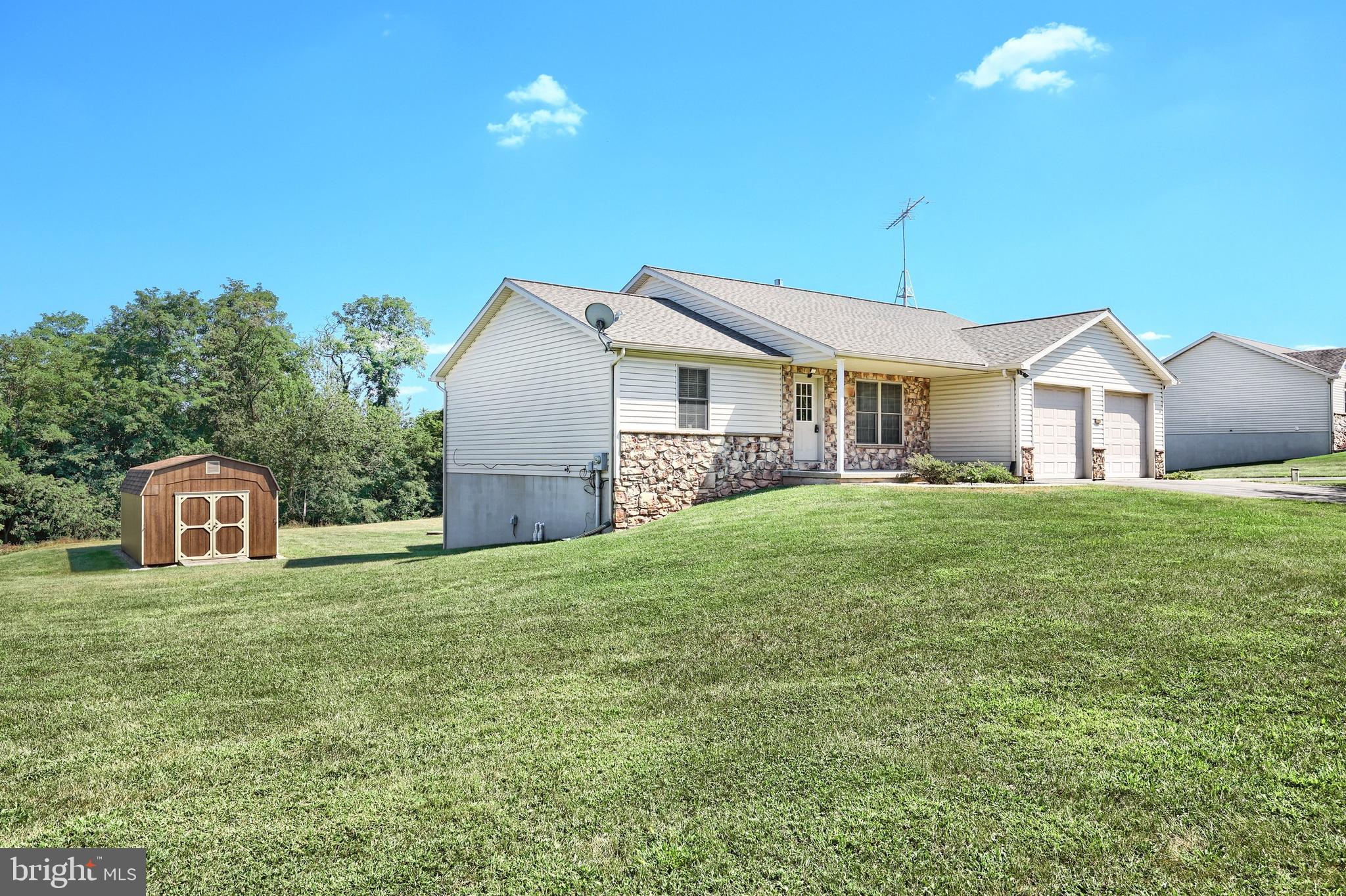 965 East Butter Road York, PA 17406 - Photo 7 of 54 a front view of a house with a garden and yard
