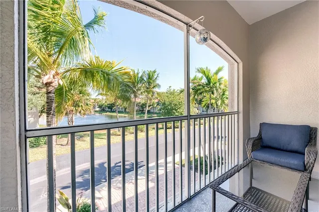 a view of a balcony with furniture