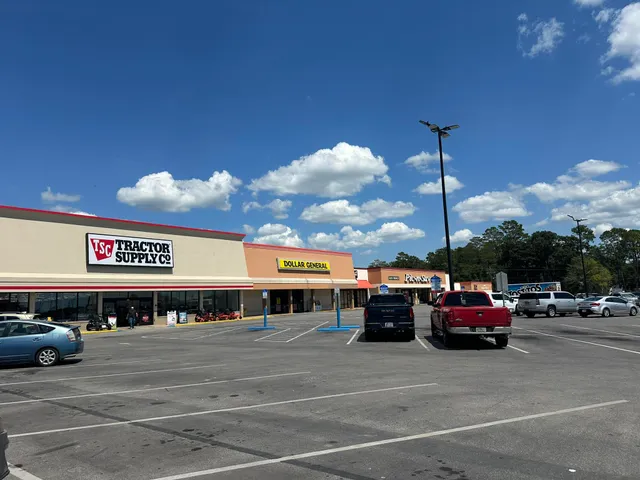 a view of a cars park in front of a building