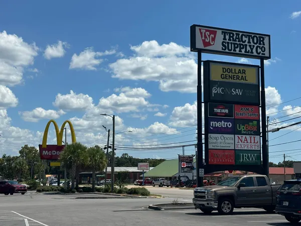 a city street with cars parked in front of it