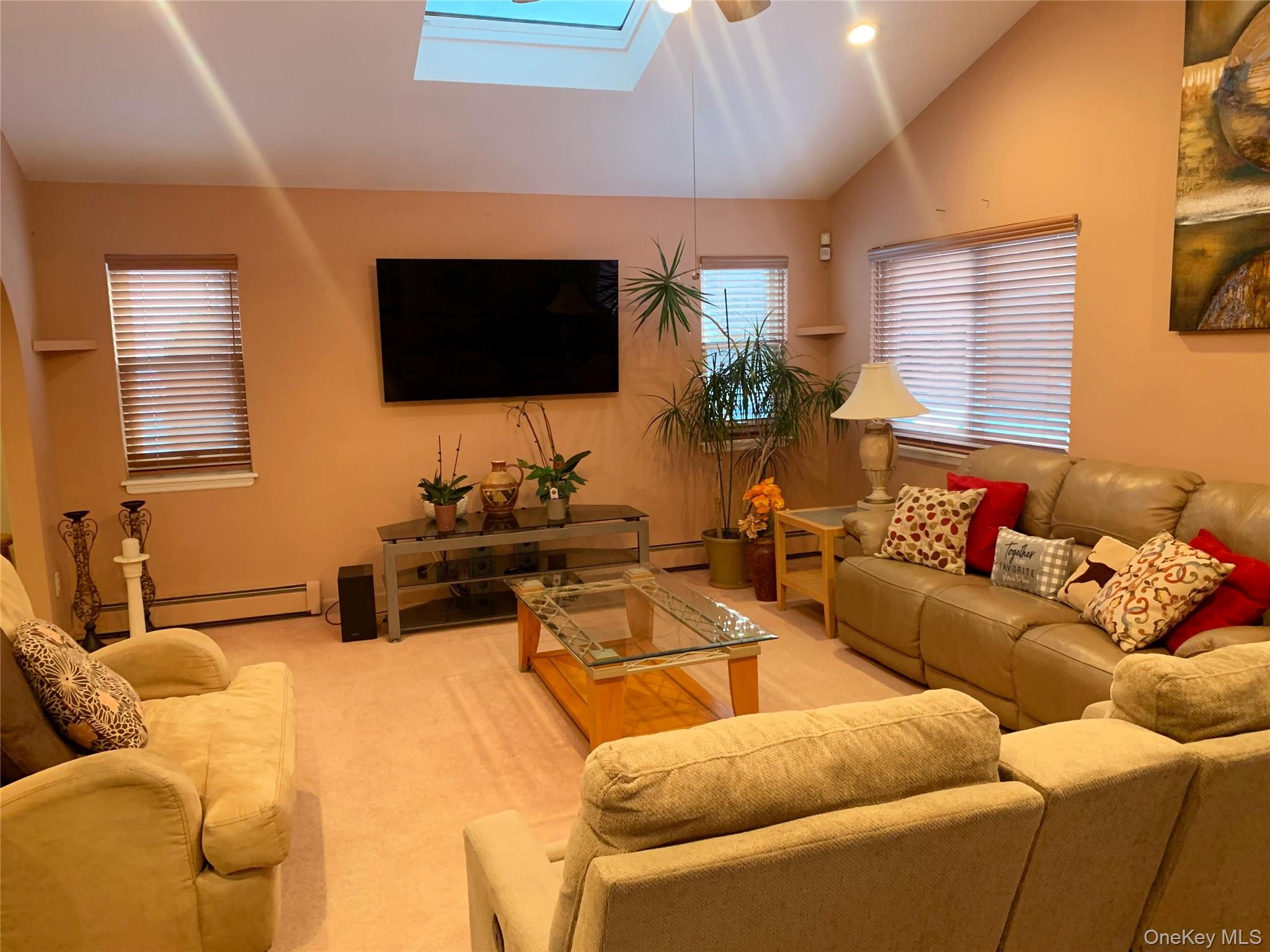 8 Autumn Lane Stony Point, NY 10980 - Photo 13 of 40 a living room with furniture a flat screen tv and a window